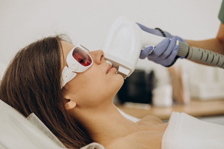 Woman receiving laser treatment at Danik Medspa for facial rejuvenation