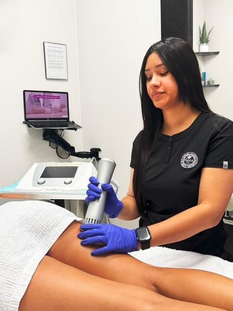 Specialist performing Z-Wave therapy for cellulite removal at Danik MedSpa.