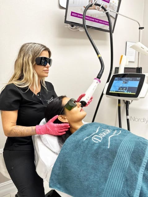 Specialist providing Fraxel laser treatment for skin resurfacing at Danik MedSpa.